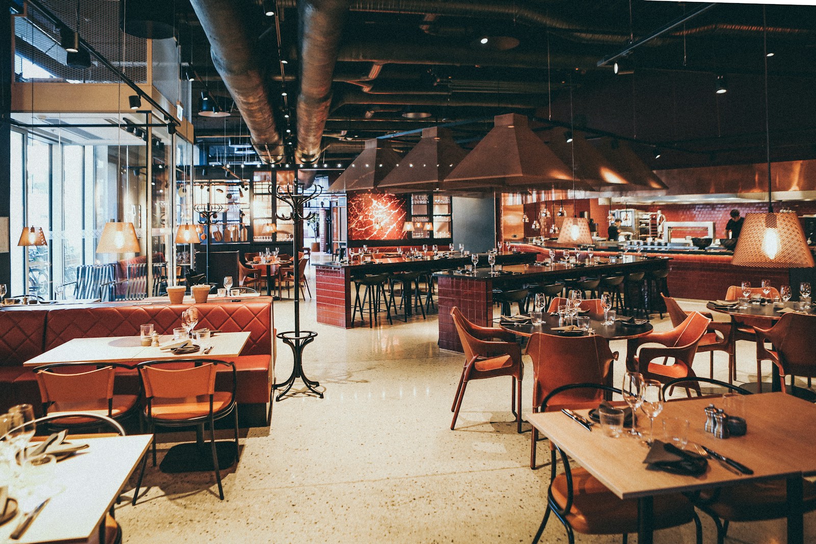 restaurant, rectangular beige wooden tables and chair